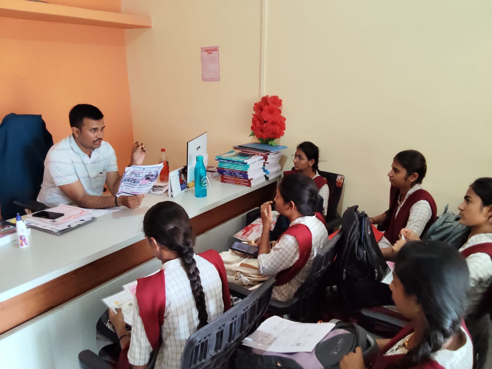 Faculty providing academic and course guidance to students during an interactive session at Khadkeshwar NEET-JEE Academy, Lonar.