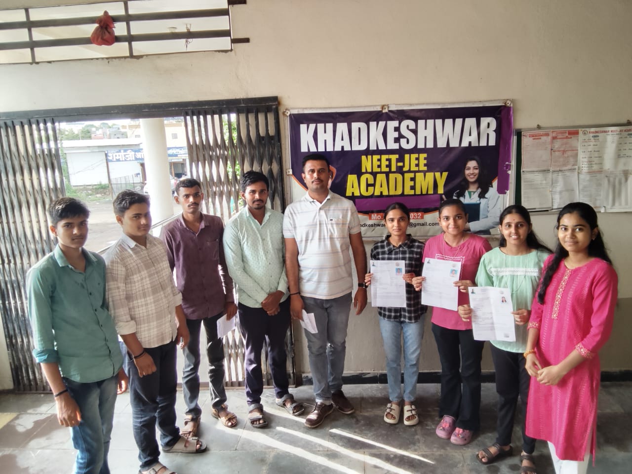 Students participating in an achievement and recognition moment at Khadkeshwar NEET-JEE Academy, Lonar.