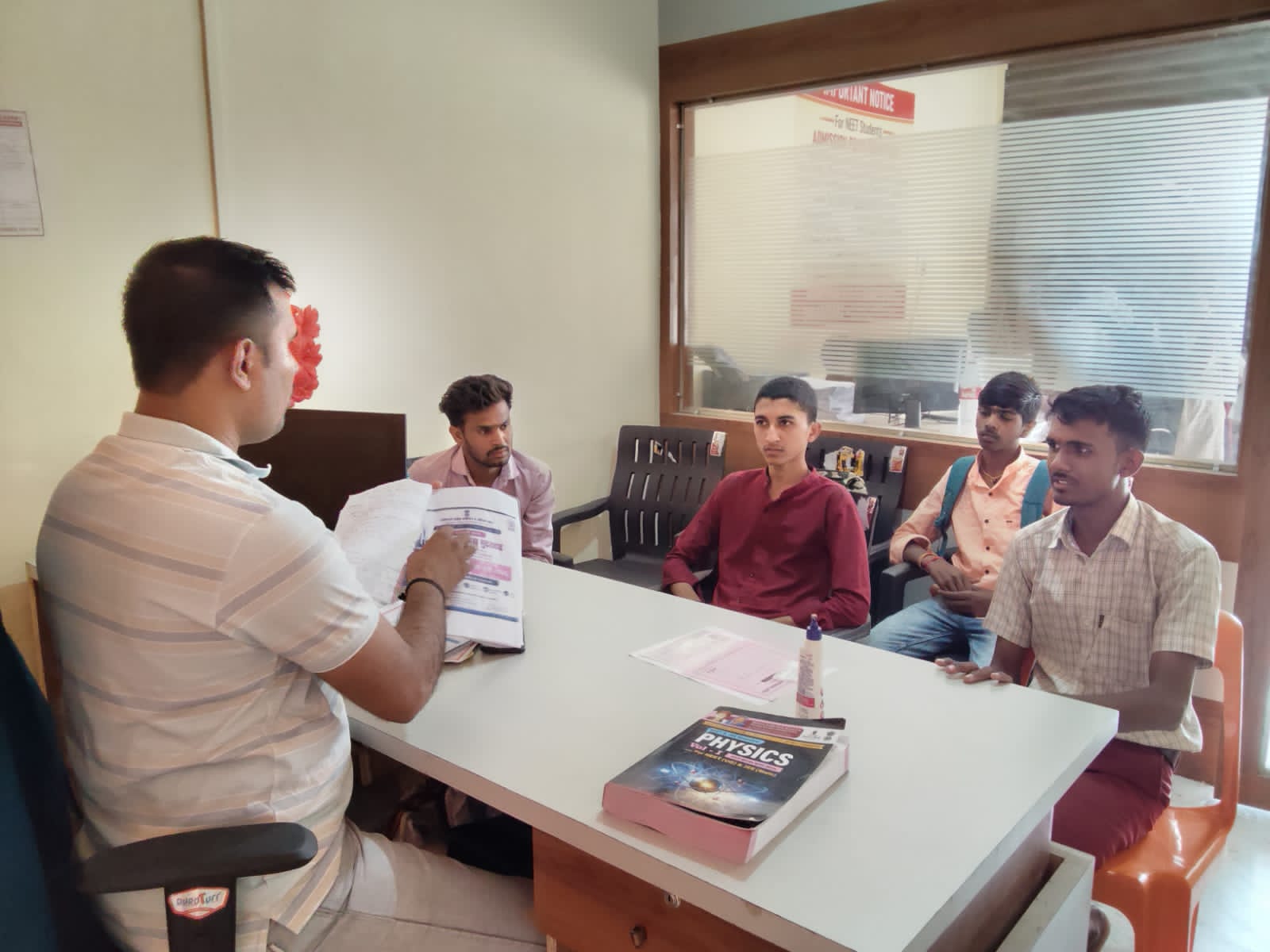 Students receiving admission documentation and academic support at Khadkeshwar NEET-JEE Academy, Lonar.